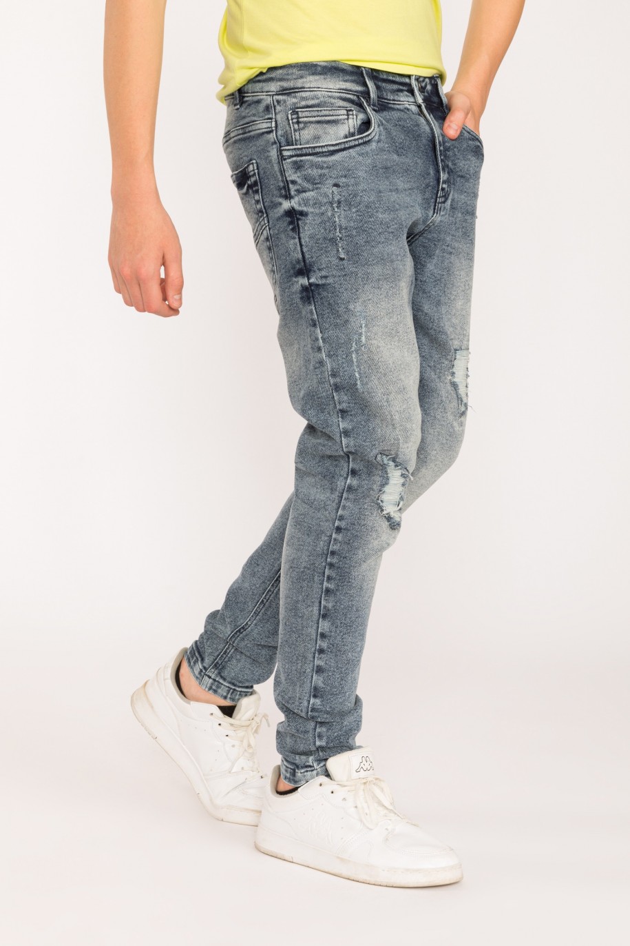 Jeansowe spodnie dla chłopaka z przetarciami - 28882