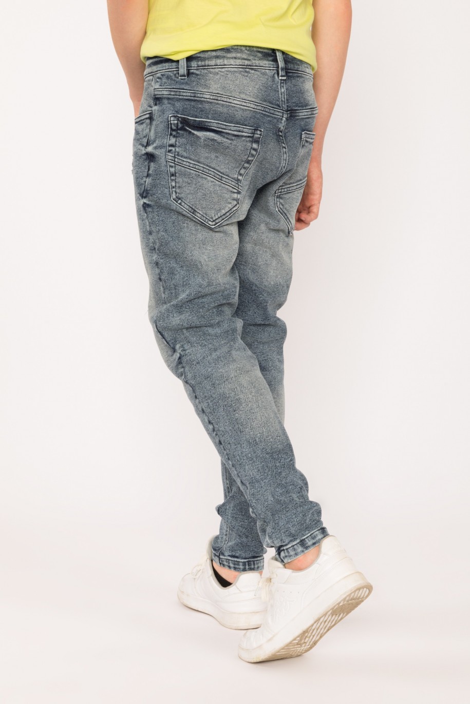 Jeansowe spodnie dla chłopaka z przetarciami - 28883