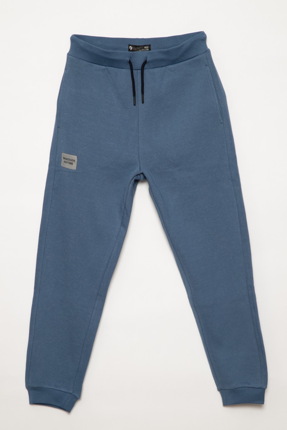 Niebieskie gładkie spodnie dresowe dla chłopaka - 31678