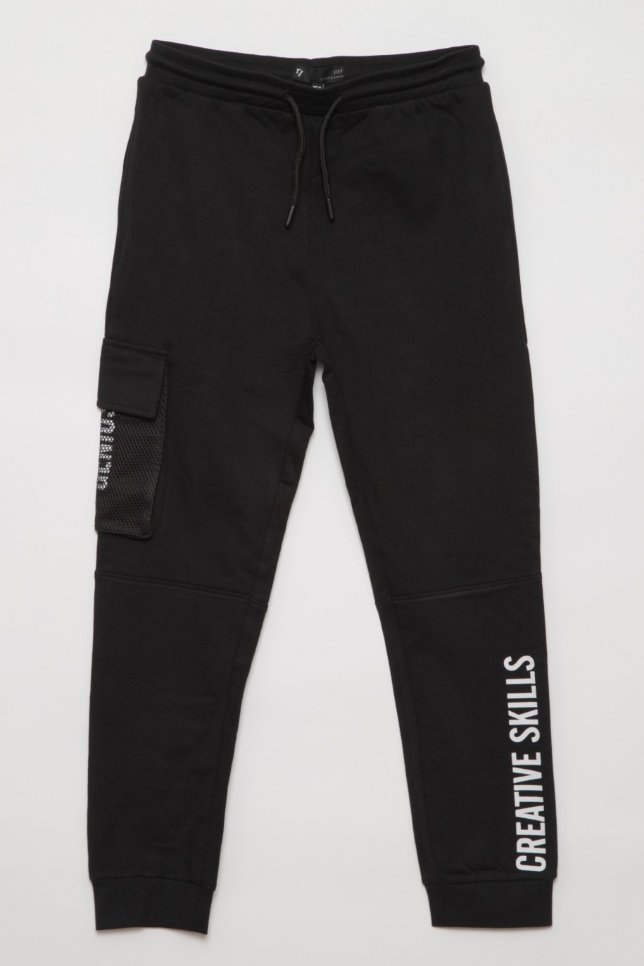 Czarne spodnie dresowe dla chłopaka CREATIVE SKILLS - 31686
