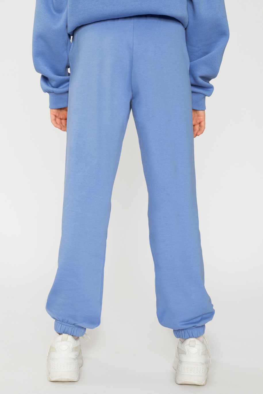 Niebieskie spodnie dresowe dla dziewczyny ze ściągaczami - 31814