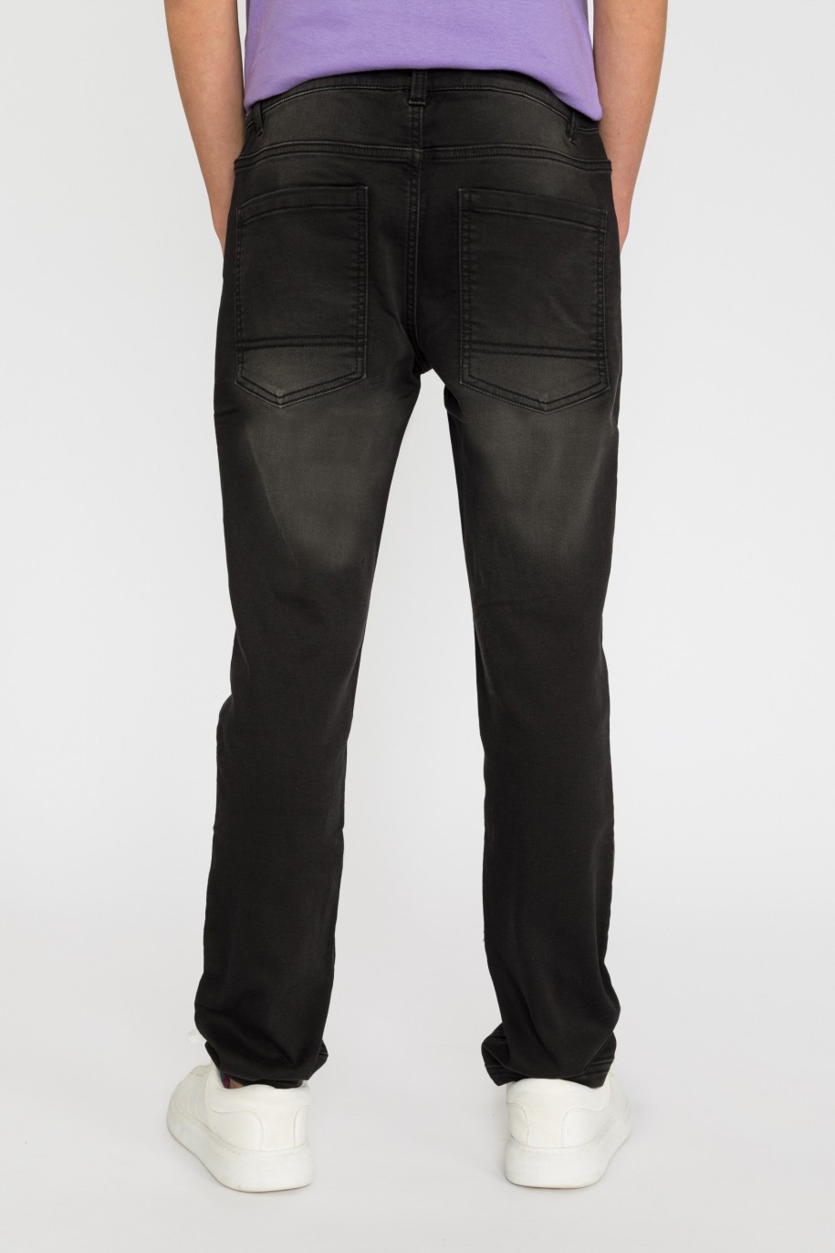 Czarne jeansowe spodnie dla chłopaka - 32099