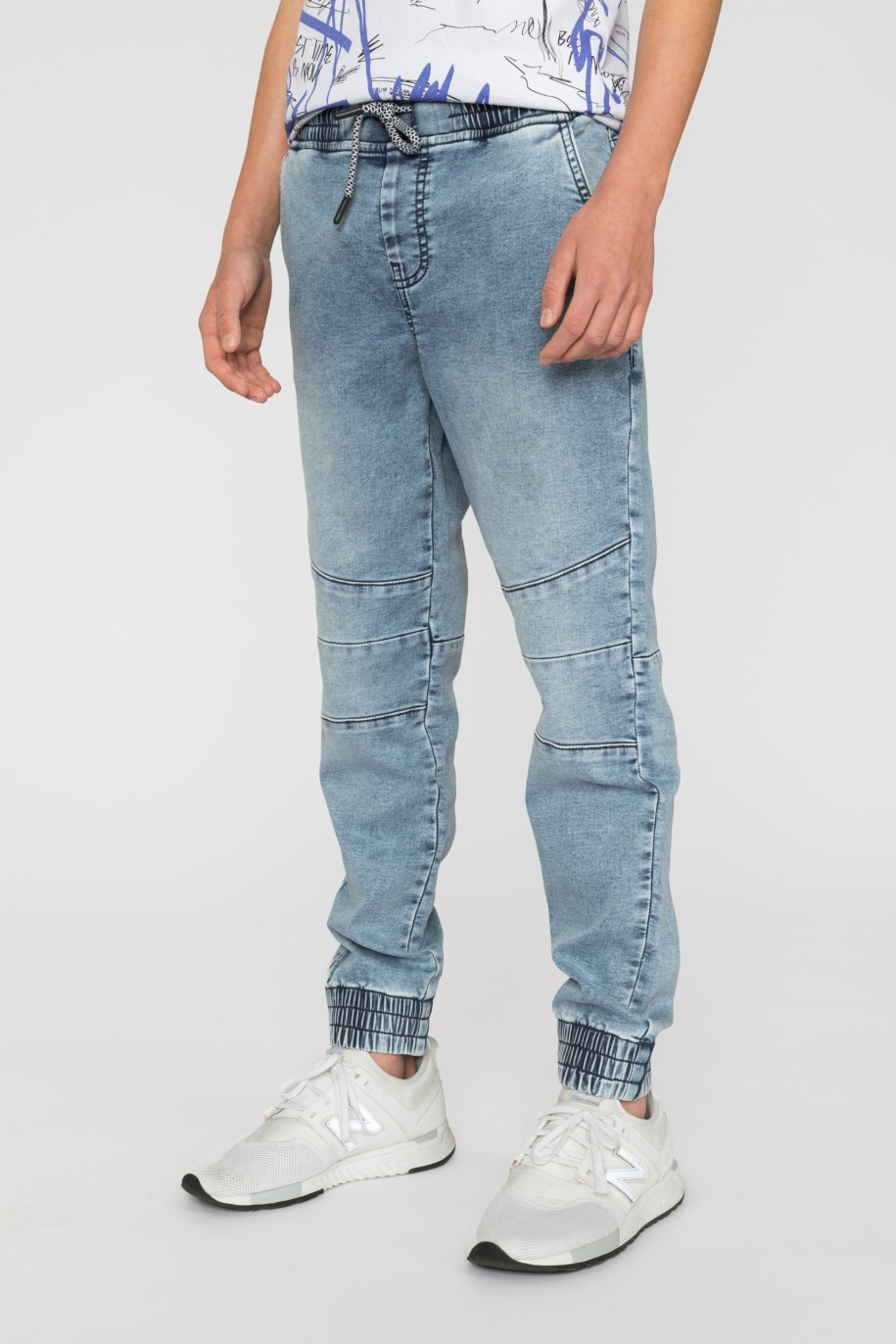 Niebieskie jeansy typu jogger ze ściągaczami dla chłopaka - 33578