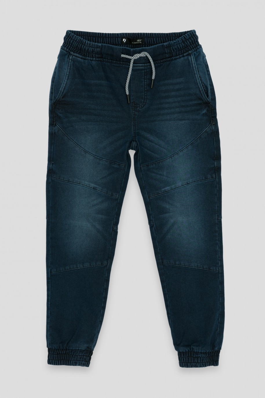 Granatowe jeansy z przeszyciami typu jogger - 36252