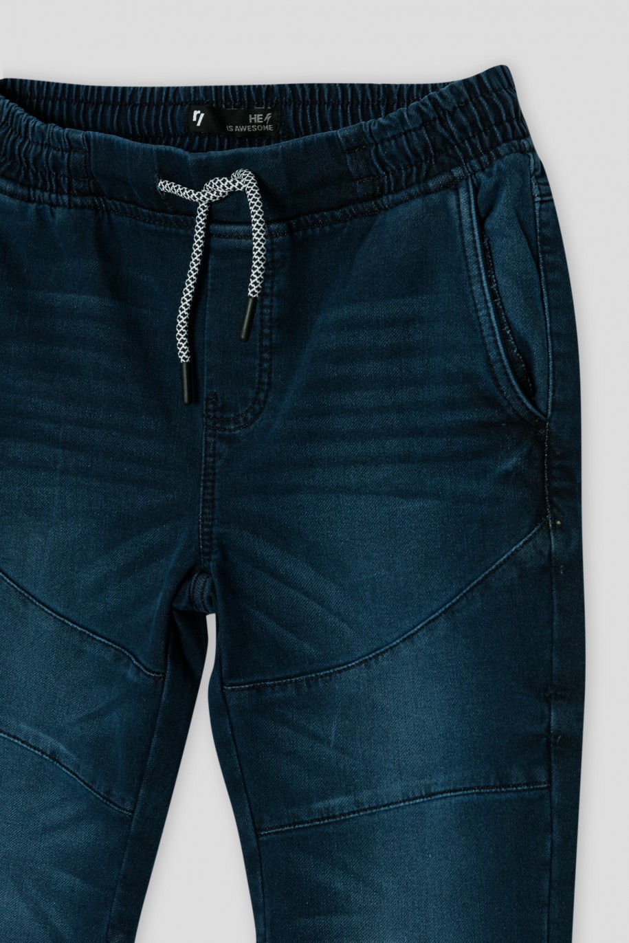 Granatowe jeansy z przeszyciami typu jogger - 36253