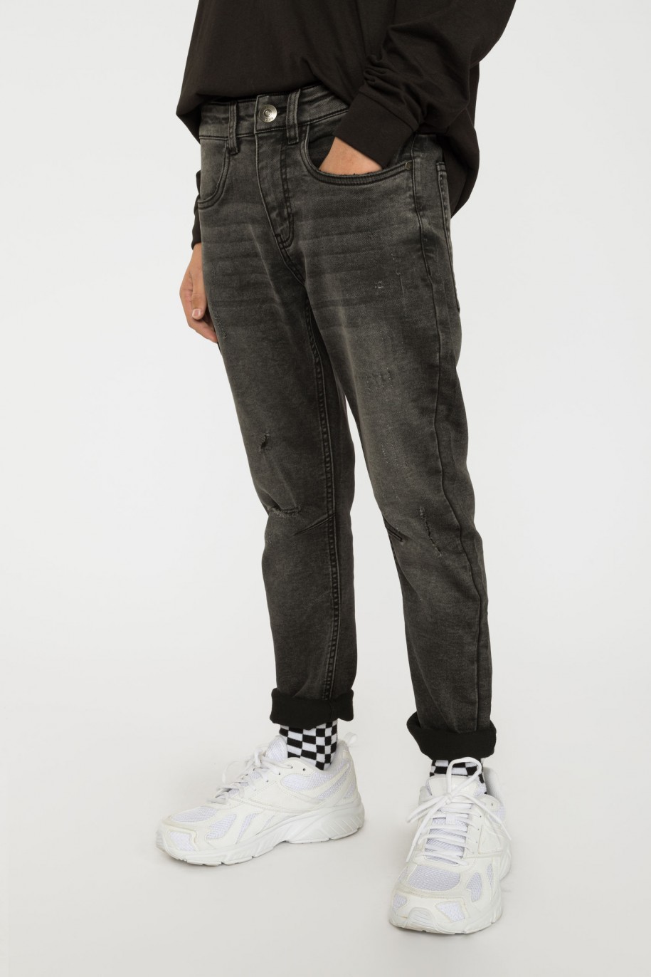 Szare jeansy z przeszyciami - 38201