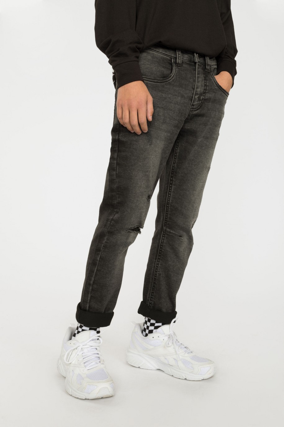 Szare jeansy z przeszyciami - 38202