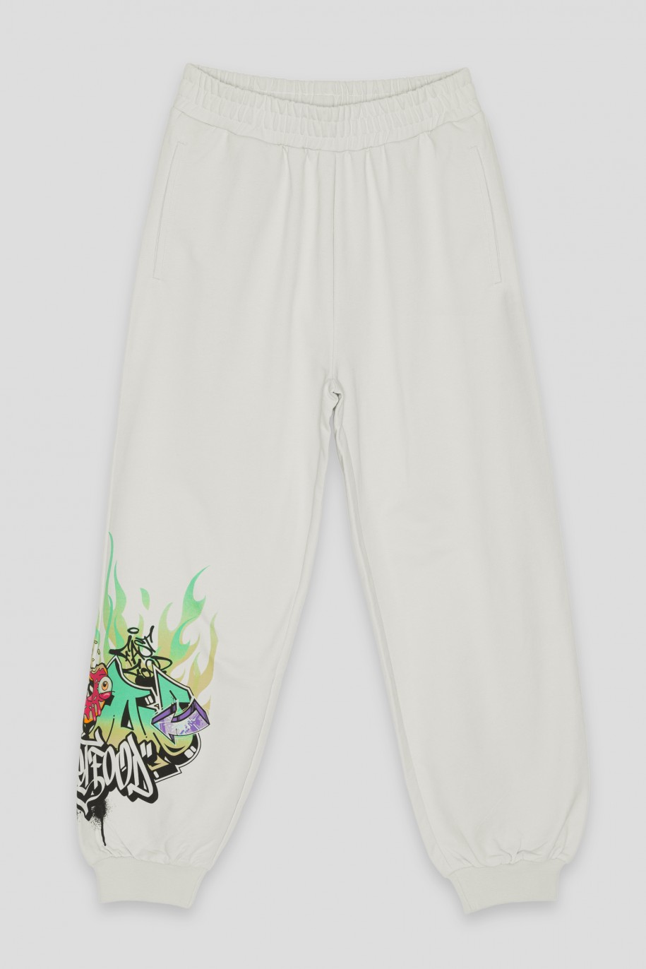 Kremowe spodnie z nadrukiem graffiti - 43060