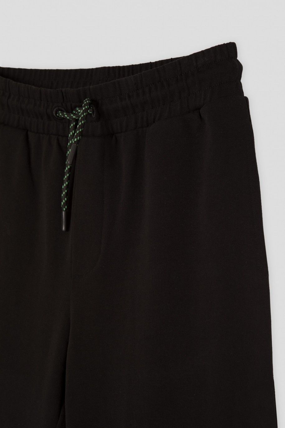 Czarne spodnie dresowe z minimalistycznym nadrukiem na ściągaczach - 45918