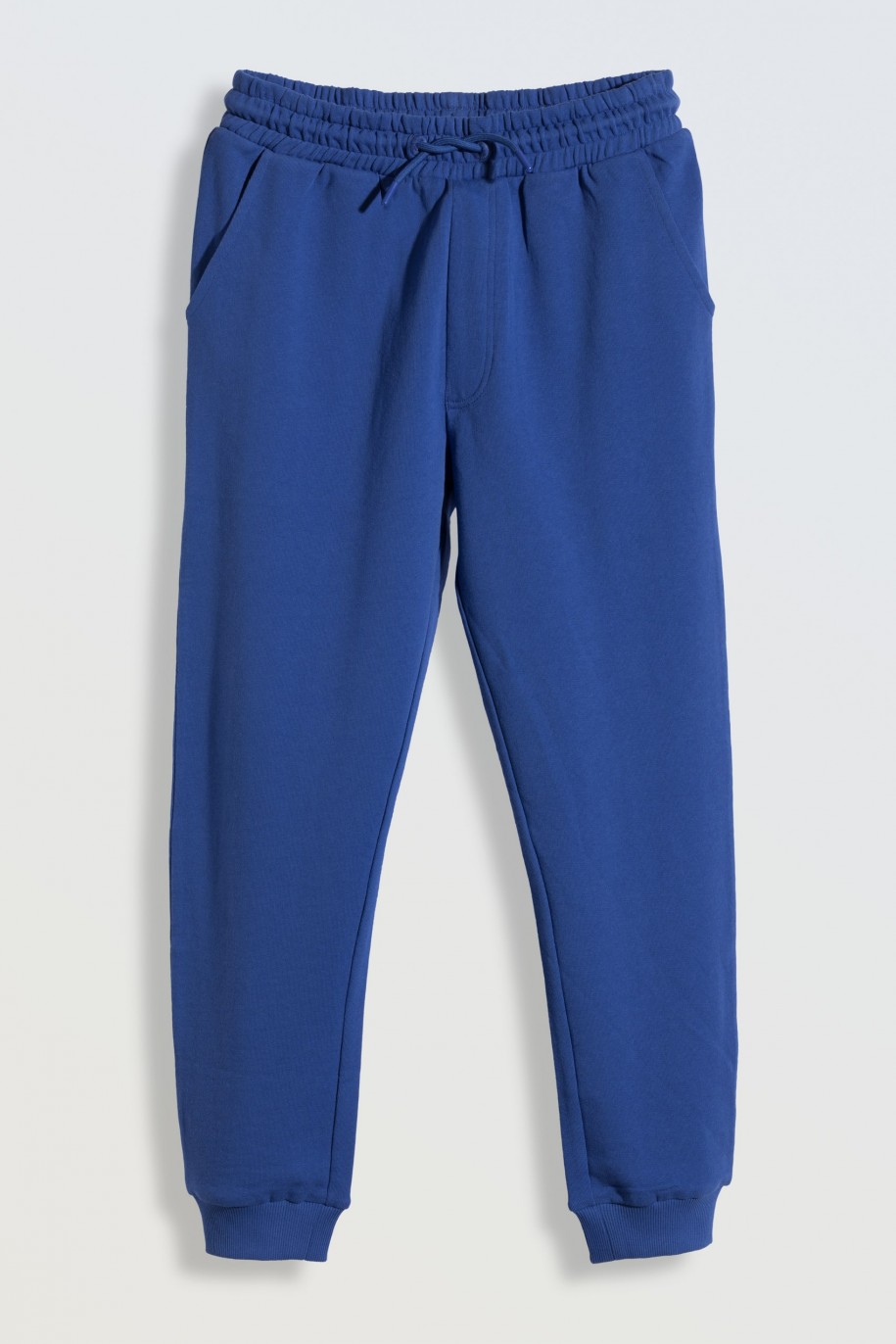 Niebieskie spodnie dresowe z nadrukiem z tyłu - 46183