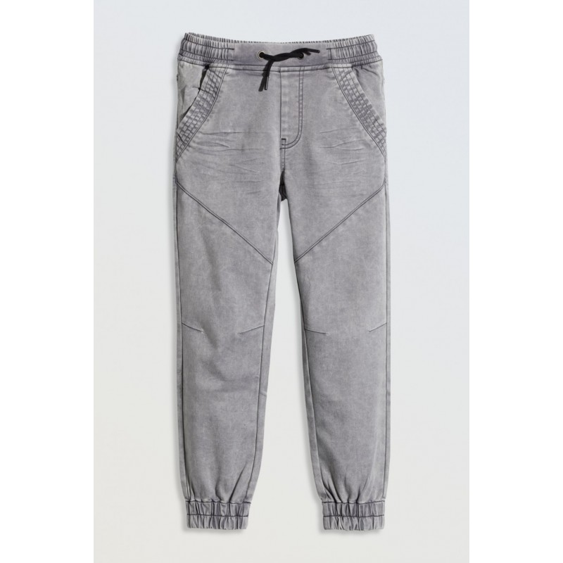 Szare spodnie jeansowe typu joggery z modnymi przeszyciami - 46550