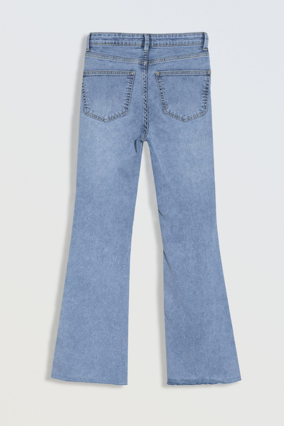 Niebieskie jeansowe dzwony z rozcięciami na nogawkach - 46560