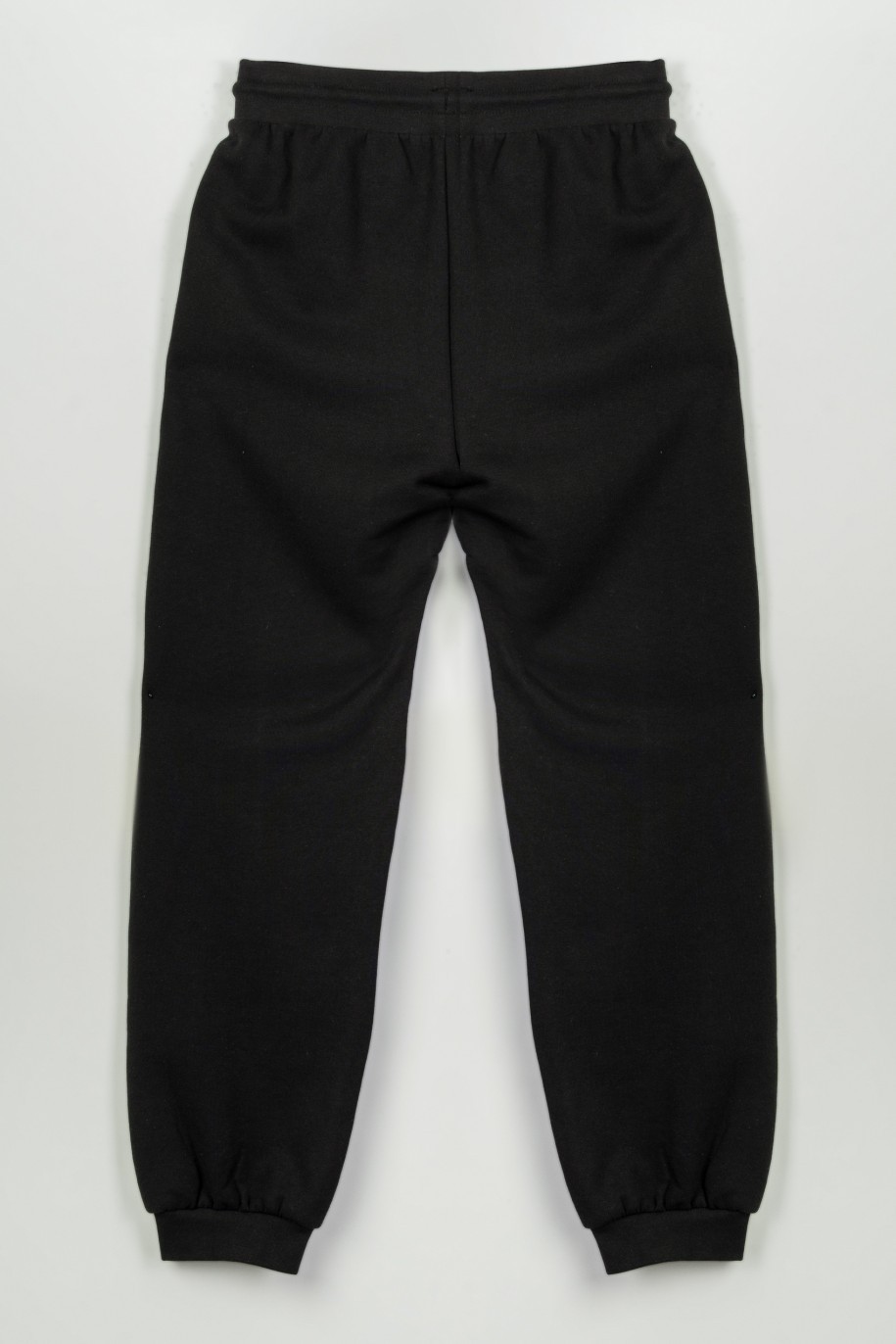 Czarne spodnie dresowe z hologramowym nadrukiem na nogawce - 47264