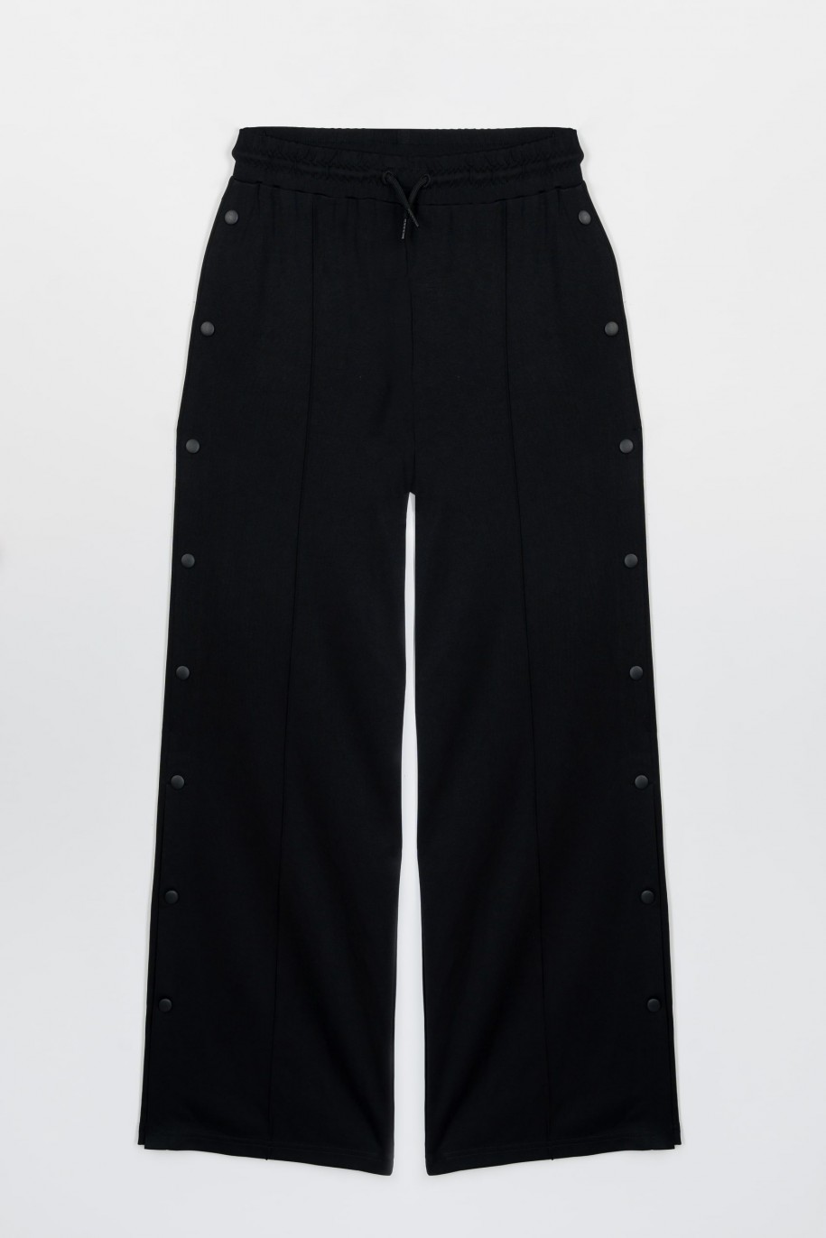 Czarne szerokie spodnie z nogawkami zapinanymi na napy - 47412