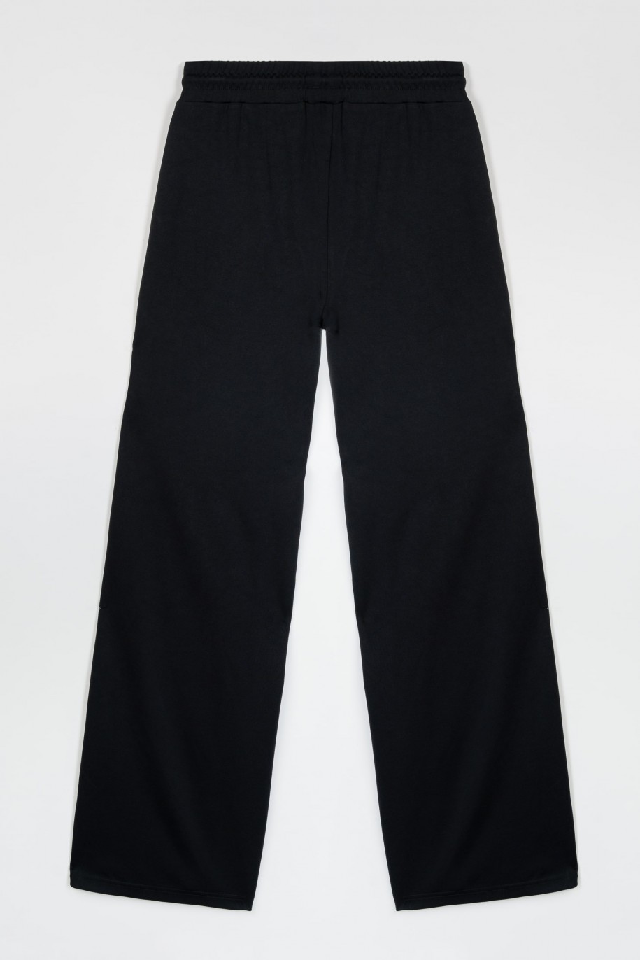 Czarne szerokie spodnie z nogawkami zapinanymi na napy - 47413
