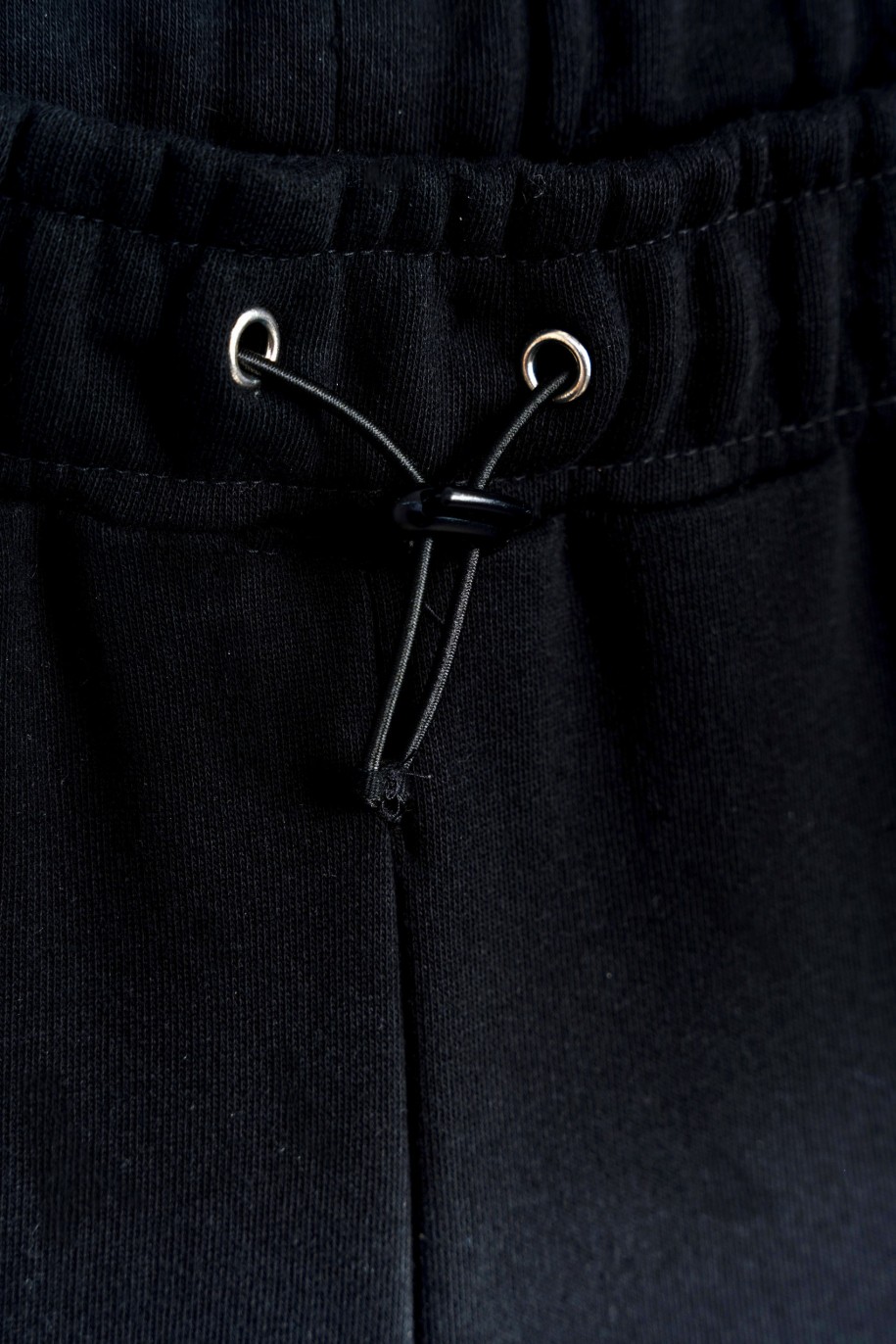 Czarne szerokie spodnie z nogawkami zapinanymi na napy - 47415